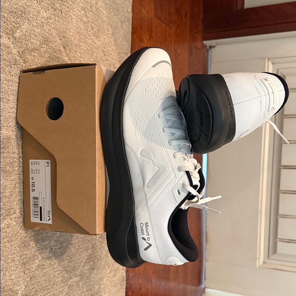 Mount to Coast P1 running shoes, black and white.